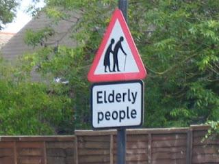 Caution sign says 'elderly people' with stereotypical silhouette