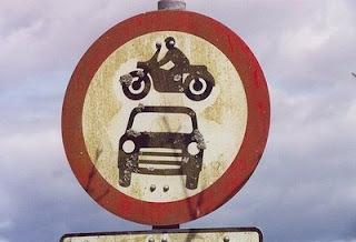 Sign shows motorbike above car