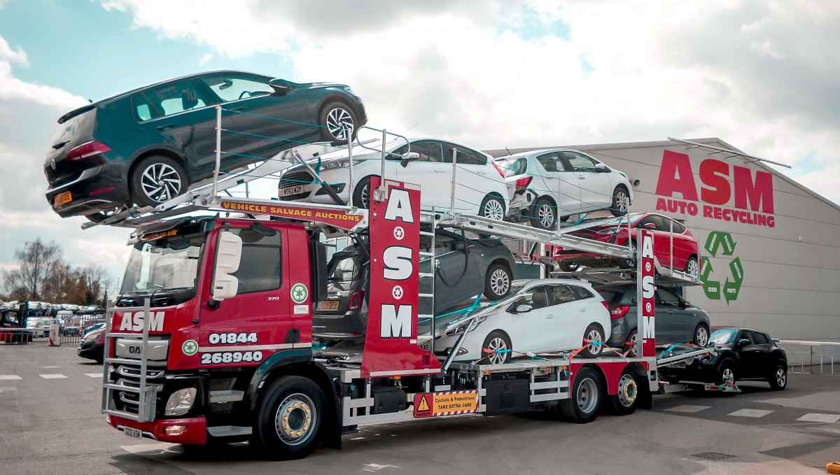 Multi-vehicle transporter outside ASM warehouse in Thame