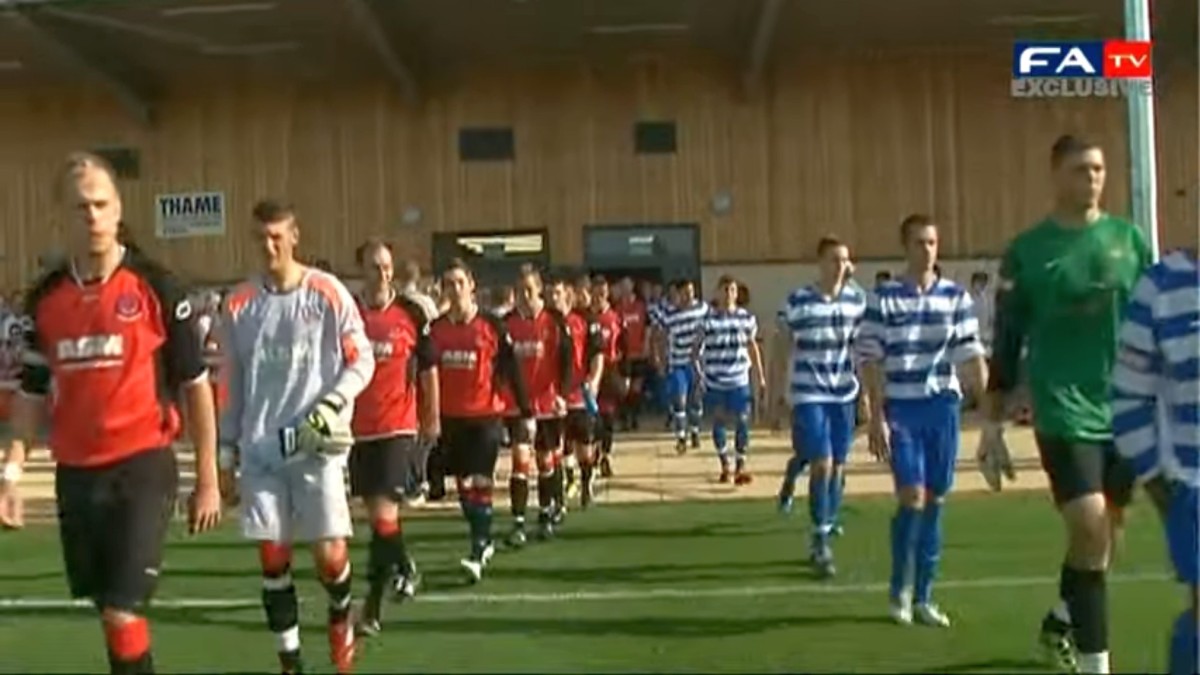 ASM sponsored Thame United FC players entering the pitch at the ASM Stadium