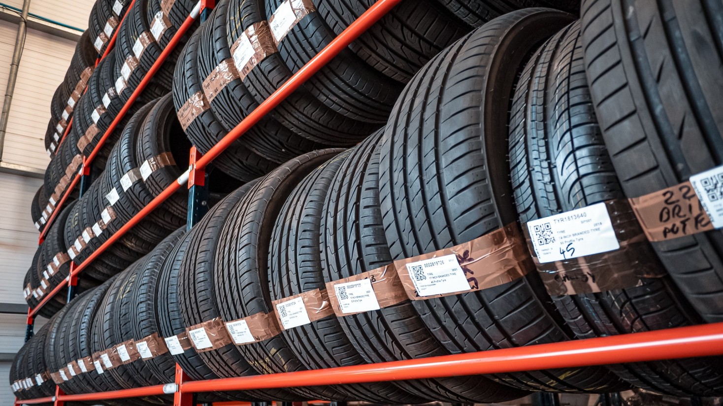 Part-worn tyres in racks close up