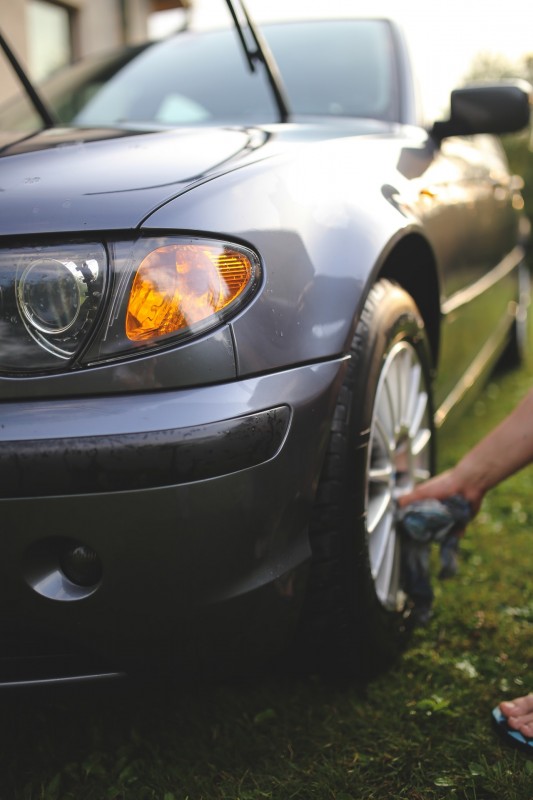 Motorist cleaning their car