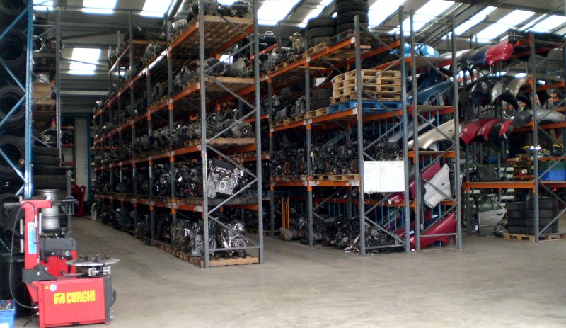 Warehouse with organised racks of used car parts