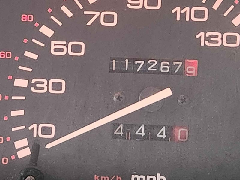 Analogue speedometer showing mileage counter