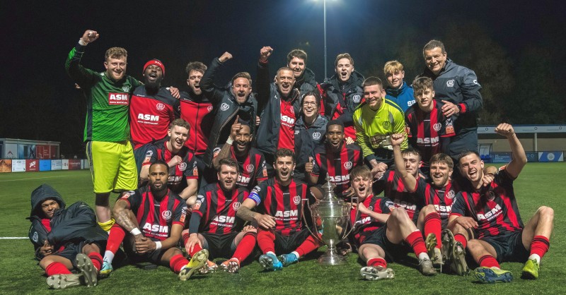 Thame United FC team gathered to celebrate a trophy win