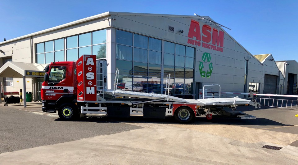 Car transporter outside ASM Auto Recycling HQ in Thame, Oxford