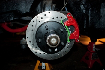 Exposed brake pad on wheel disc