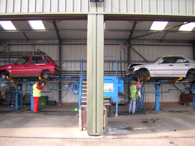 ASM staff on de-pollution rigs in the workshop